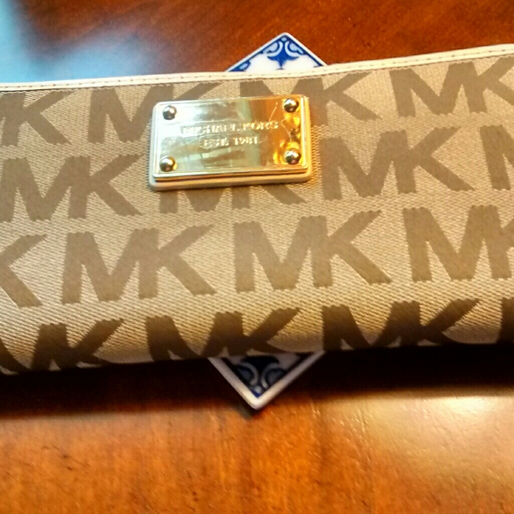 Michael Kors large wallet, inside is gold